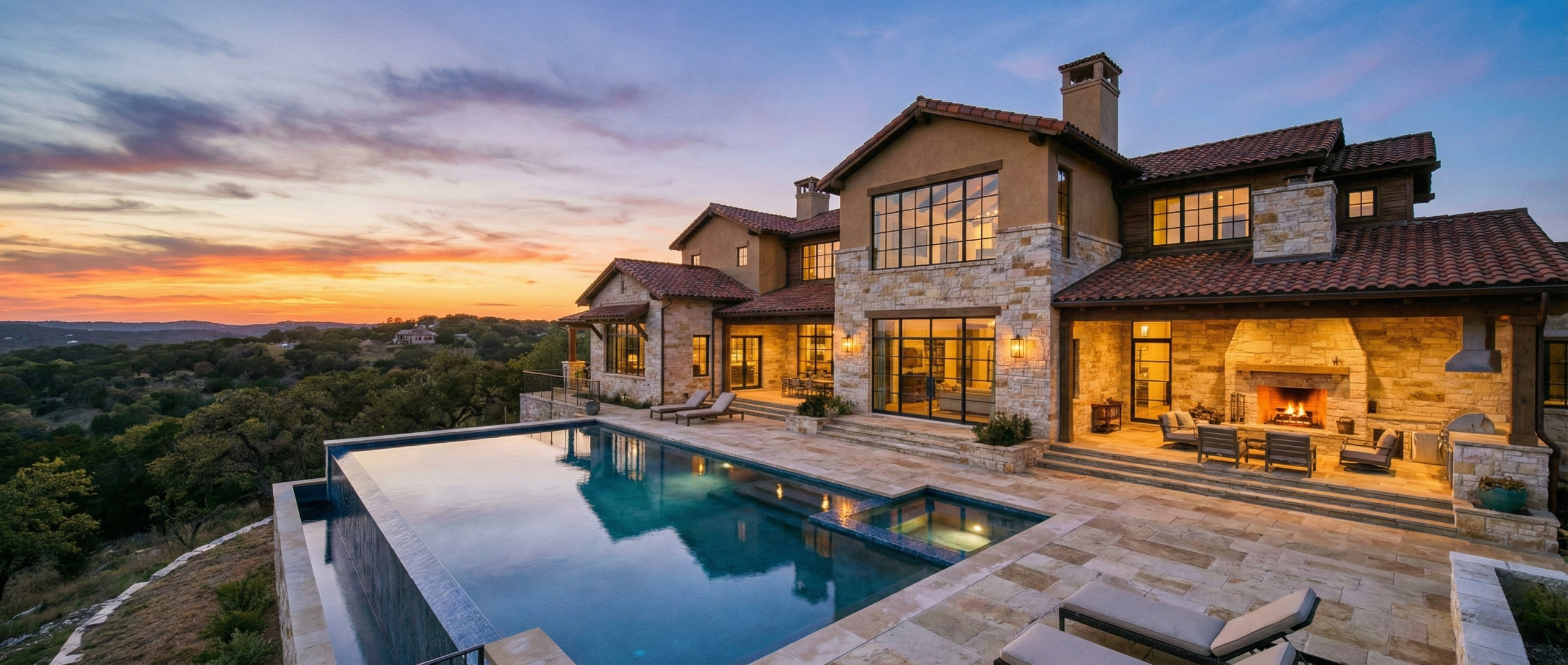 Luxury home at sunset in one of the best San Antonio neighborhoods near the Hill Country with a pool and scenic views.