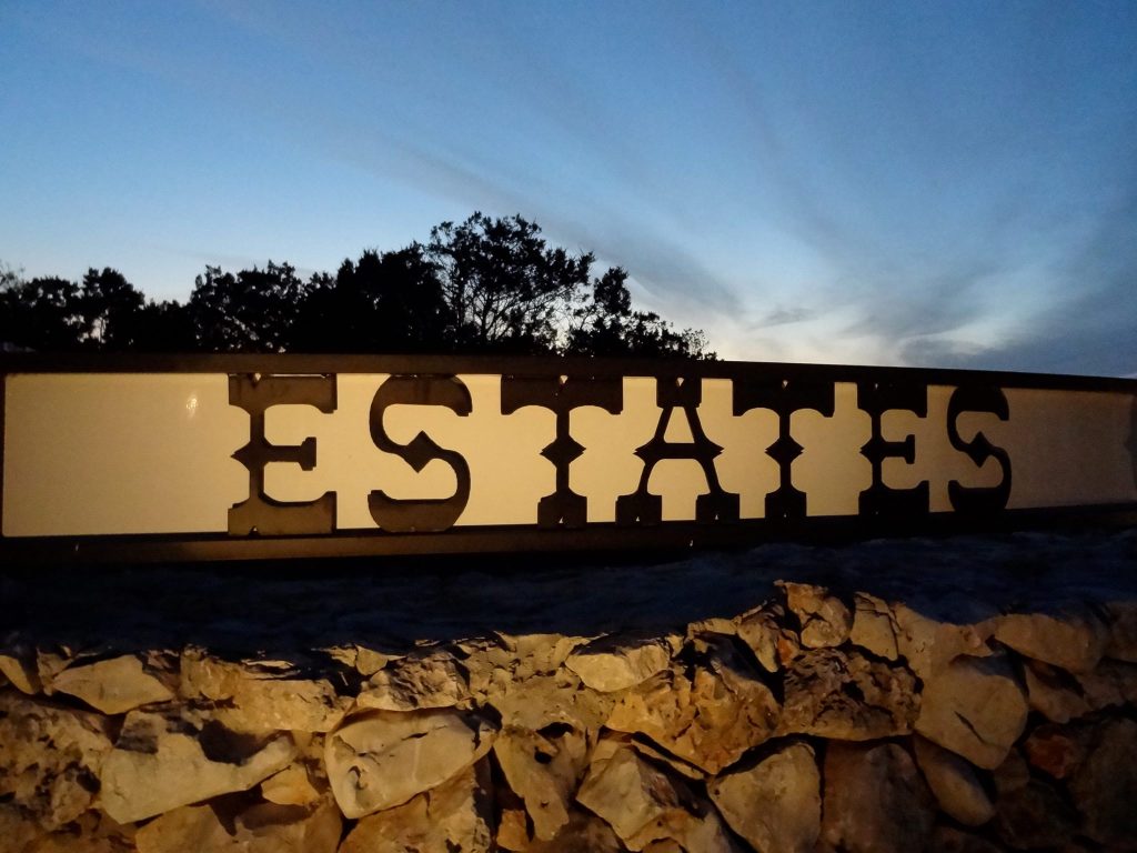 Rockwall Ranch New Braunfels TX estate community entrance sign at dusk